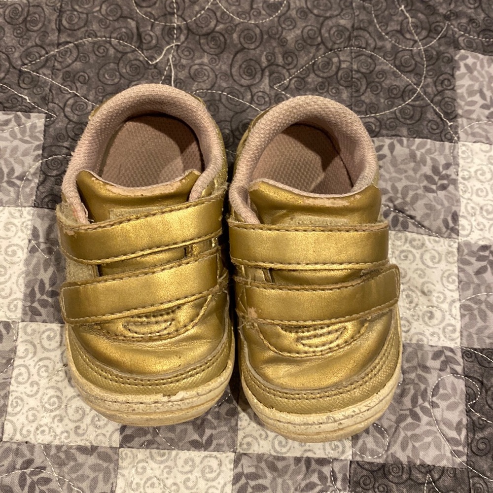 Gold tennis shoes